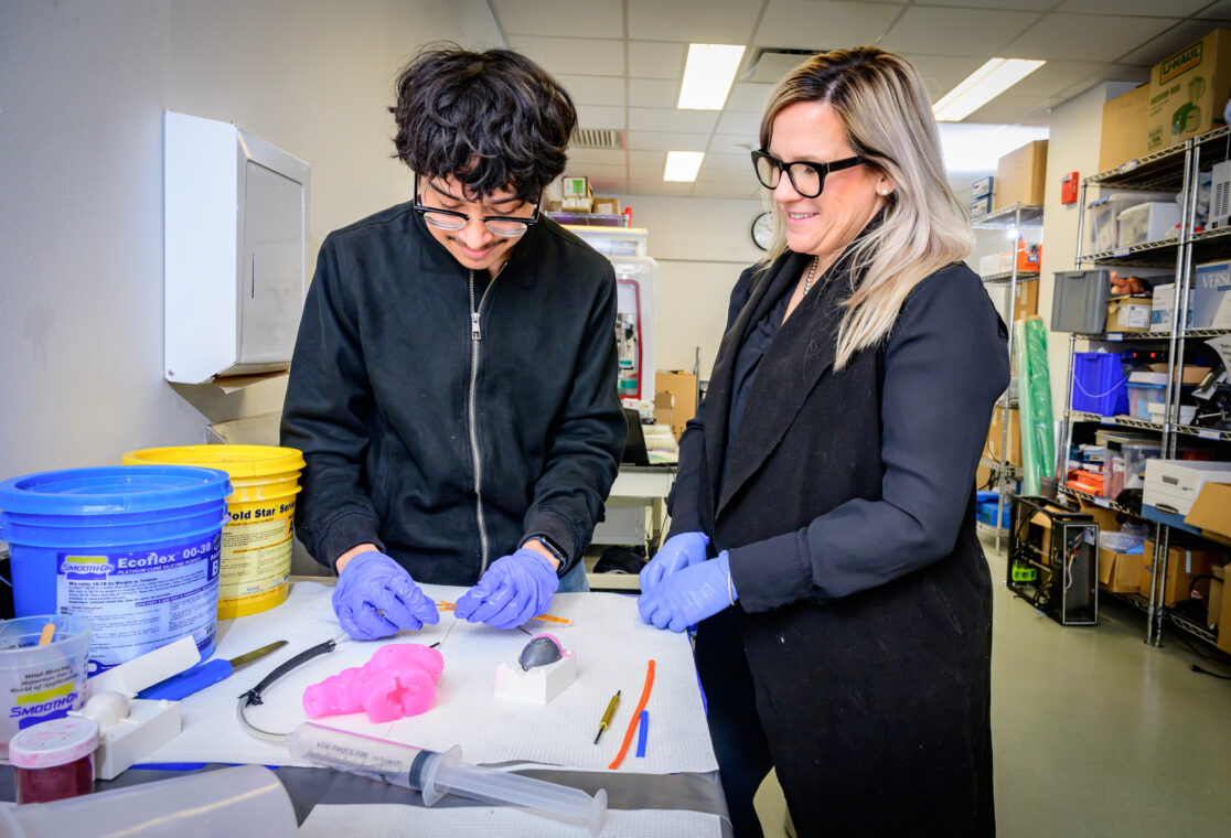 <em>FGSRP participant Andy Granados works with bioengineering professor Holly Golecki. Photo by Fred Zwicky.</em>