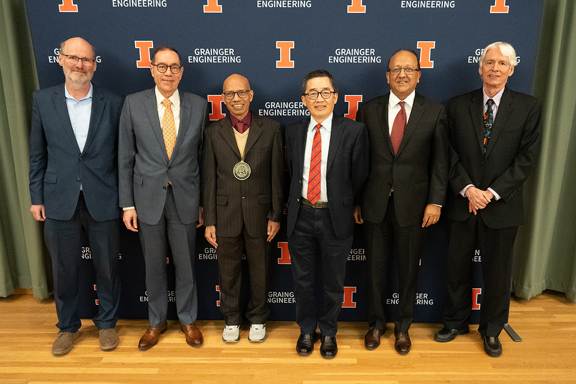 Saif, third from left, with members of the Grainger Engineering and MechSE administrations