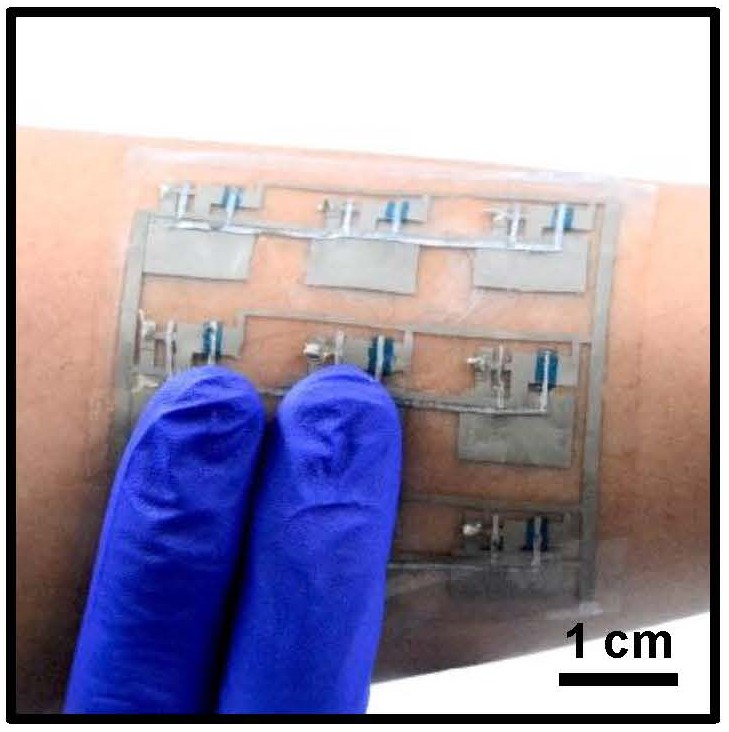 Demonstration of how the stretchable skin might be adhered to a person's arm.