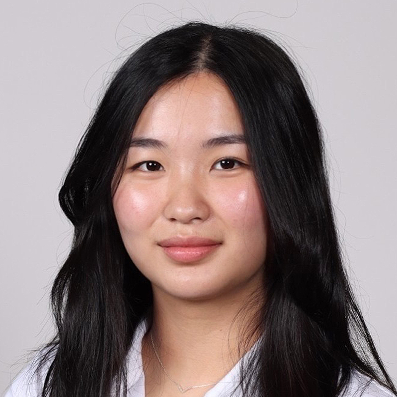 A student with long dark hair