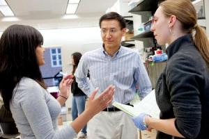 Sheng Zhong, center, with undergraduate researchers palak Doshi, left, and Meagan Musselman.