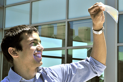 Erich Lidstone, M.D./Ph.D. student in Bioengineering, shows photonic crystal sensor material.