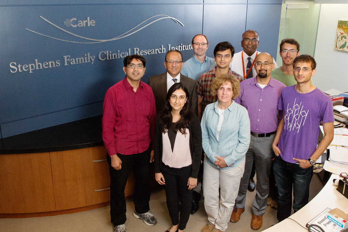 Researchers and physicians from the U. of I. and Carle Foundation Hospital developed a rapid test to find sepsis markers in a single drop of blood. Pictured, front row, from left: Astha Tanna and Dr. Karen White. Second row: Umer Hassan, Rashid Bashir, Tanmay Ghonge, Dr. Bobby Reddy Jr. and Ishan Taneja. Third row: Dr. Tor Jenson, Dr. James Kumar and Jacob Berger.

Photo by L. Brian Stauffer