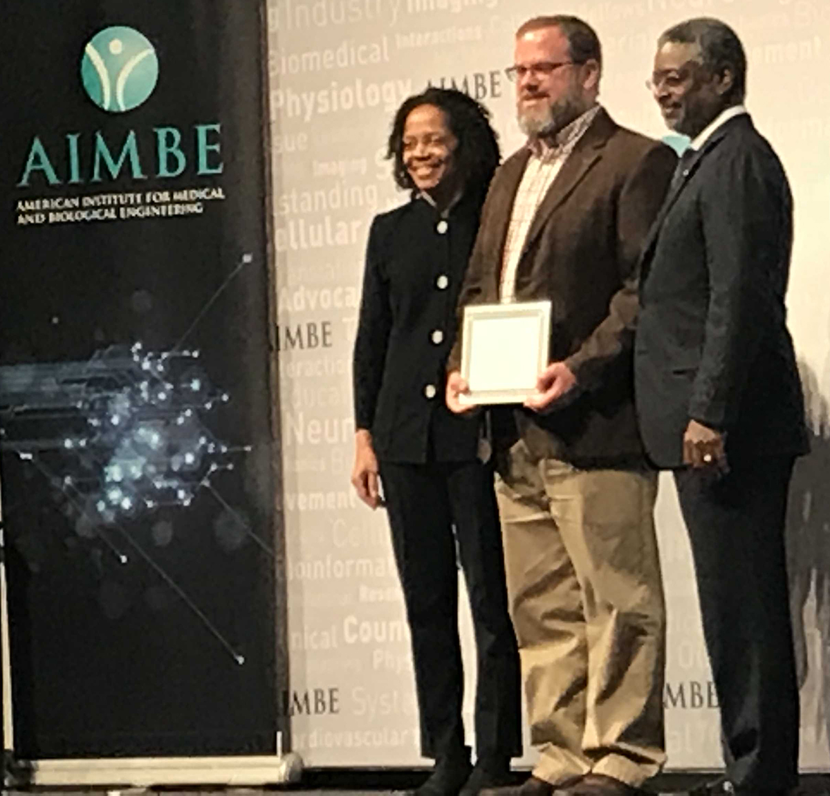 Bioengineering Professor Brad Sutton (center) was inducted as a fellow of the American Institute for Medical and Biological Engineering today at the organization's annual meeting in Washington, DC. 