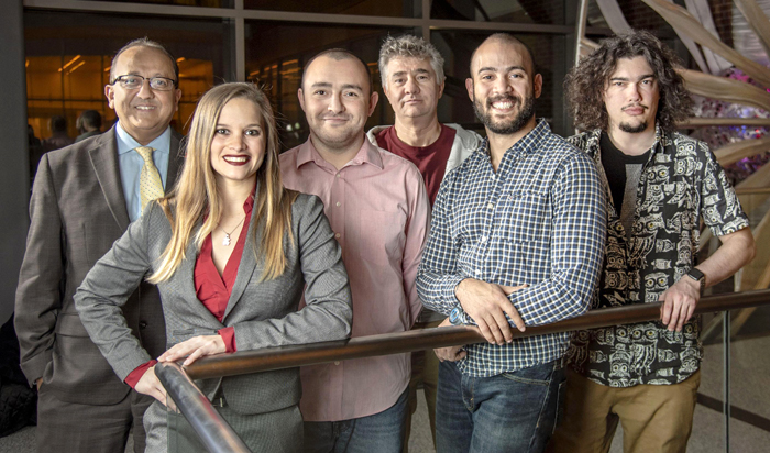 Gelson Pagan-Diaz, second from right, is pictured with his interdisciplinary team, from left, Dean Rashid Bashir, Karla Ramos-Cruz, Onur Aydin, Prof. Gabriel Popescu, and Mikhail Kandel, far right. Not pictured are Prof. Taher Saif and Richard Sam.