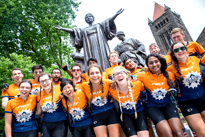 The Illini 4000 team from Summer 2019 makes a stop at the University of Illinois in front of the Alma Mater statue.