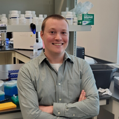 A bioengineering graduate student conducts synthetic biology research to develop a therapy for Duchenne Muscular Dystrophy. 