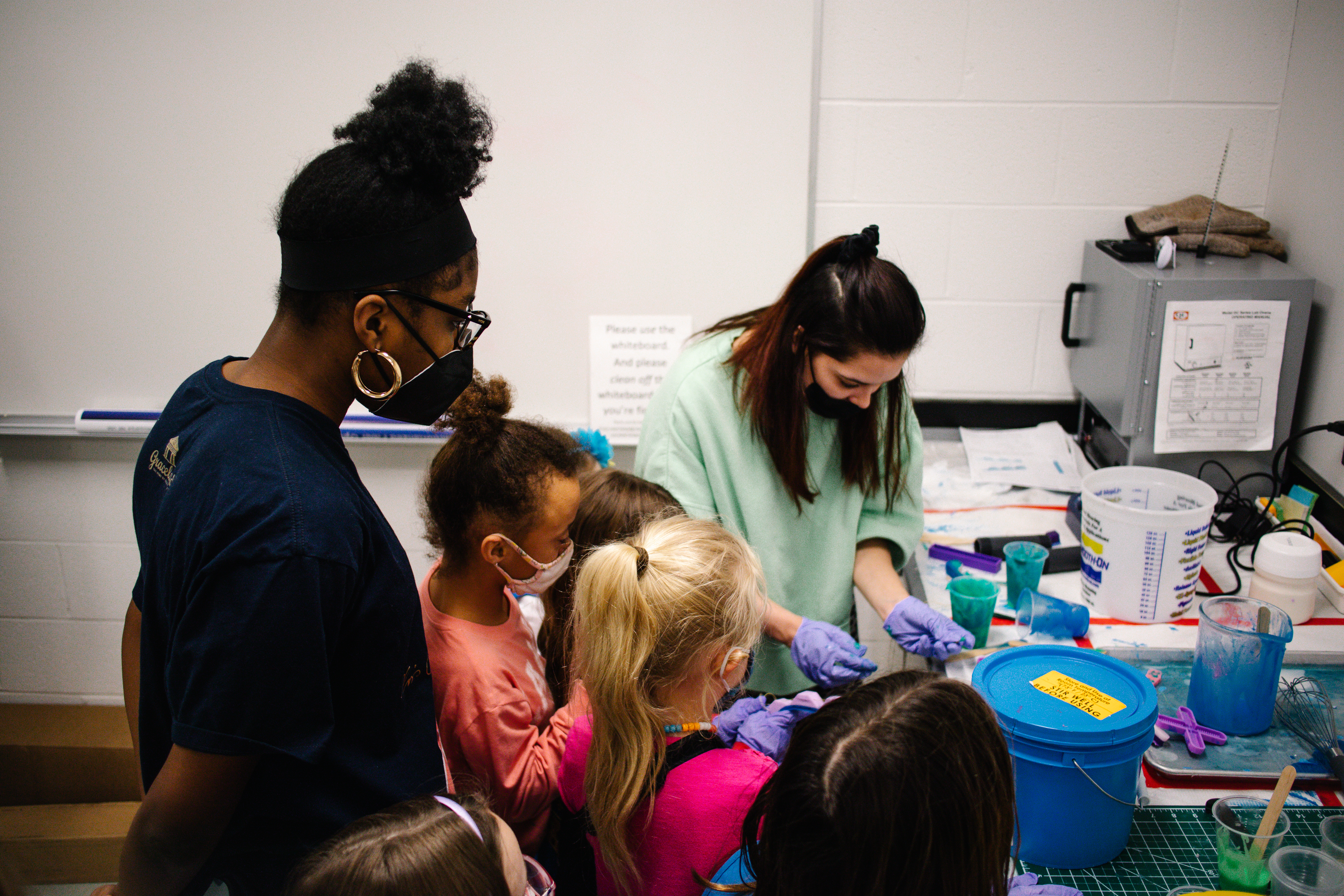 Illinois student volunteers assist with robotics building activities
