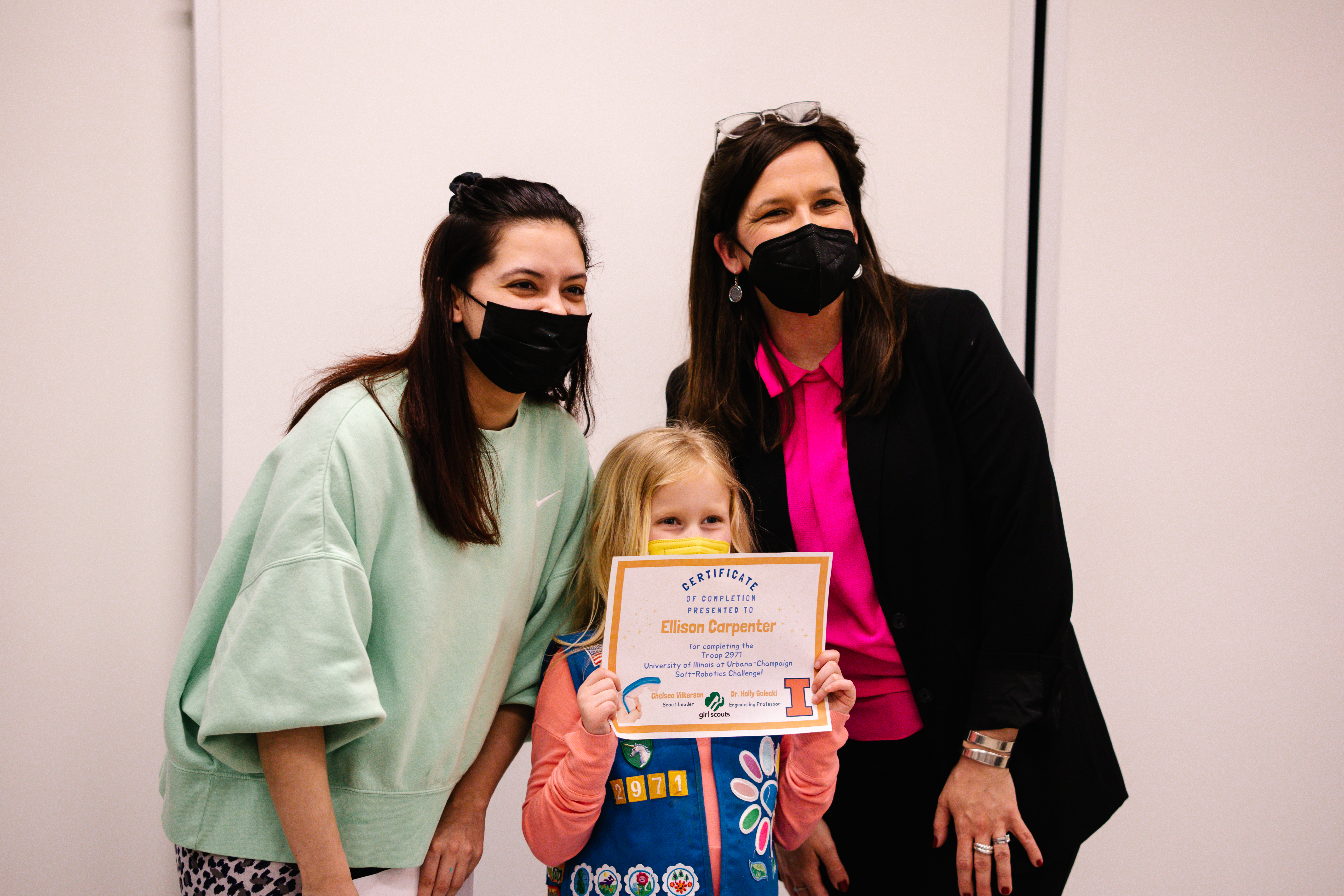 Girl scout proudly displaying her certificate