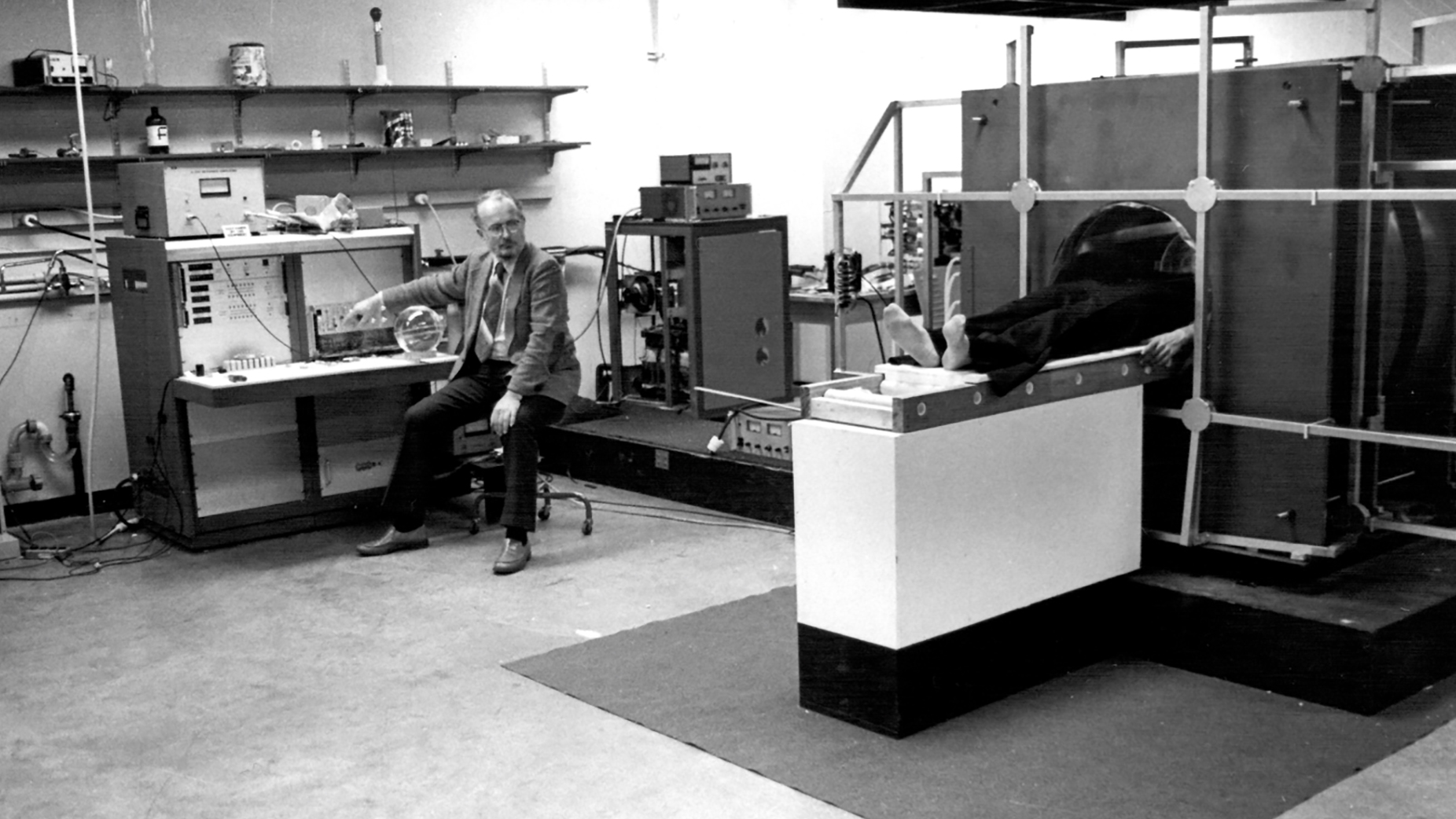 Paul Lauterbur and Big Red, the first human MRI scanner. Photo courtesy of Stony Brook University.