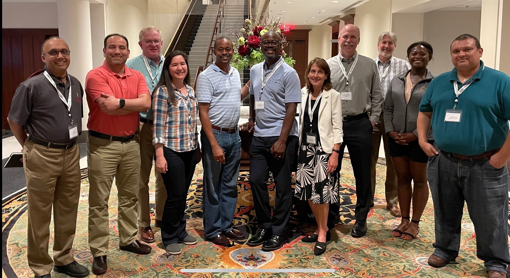 Bioengineering professors Enrique Valera (second from left) and Shannon Sirk (third from left, front row) attending the 2022 Rising BME Scholars annual regional conference.