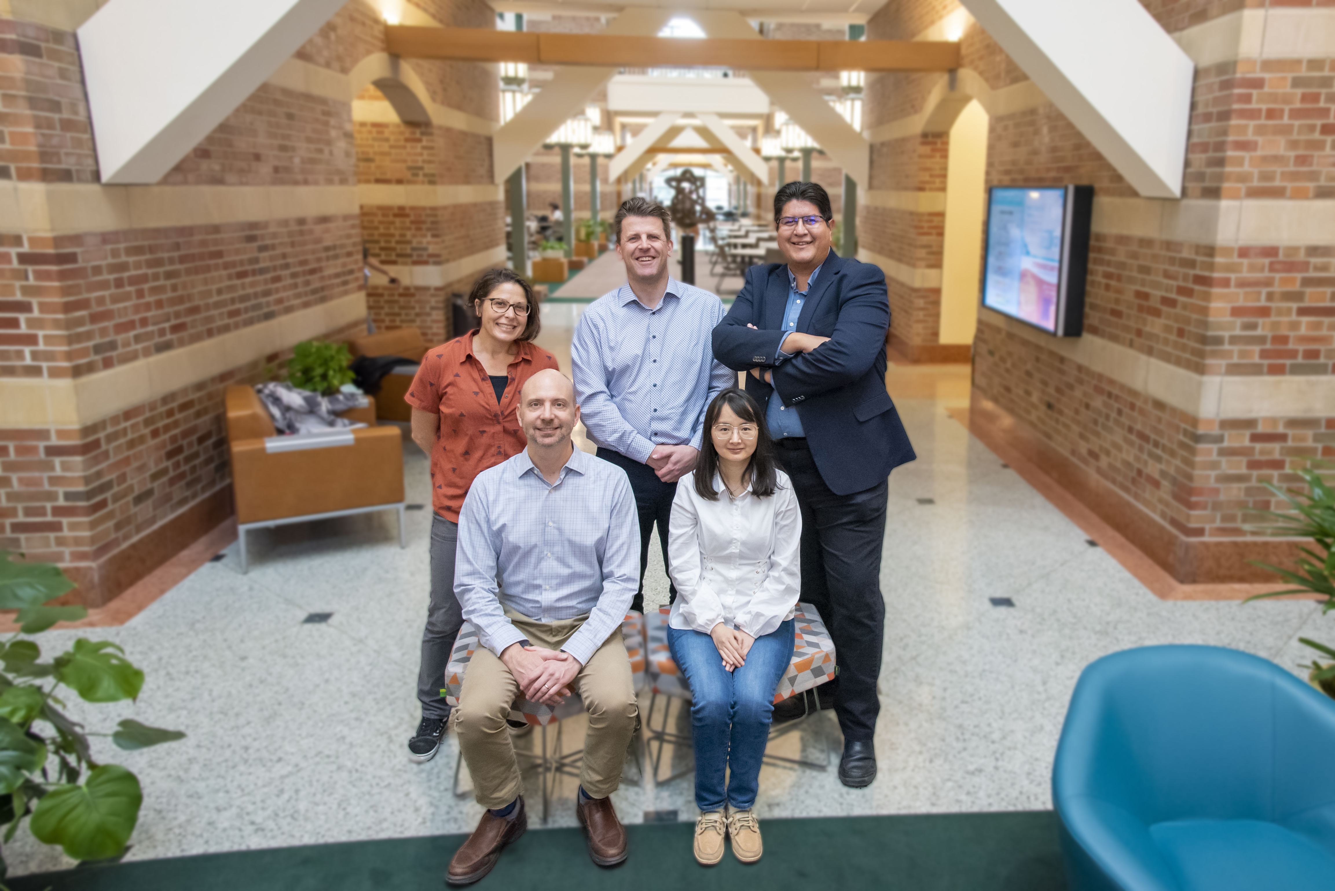 Members of the DROPLETS team. Top row, from left: Lisa Olshansky, Paul Kenis, and Joaqu&iacute;n Rodr&iacute;guez-L&oacute;pez. Seated row, from left: Charles Schroeder and Qian Chen.