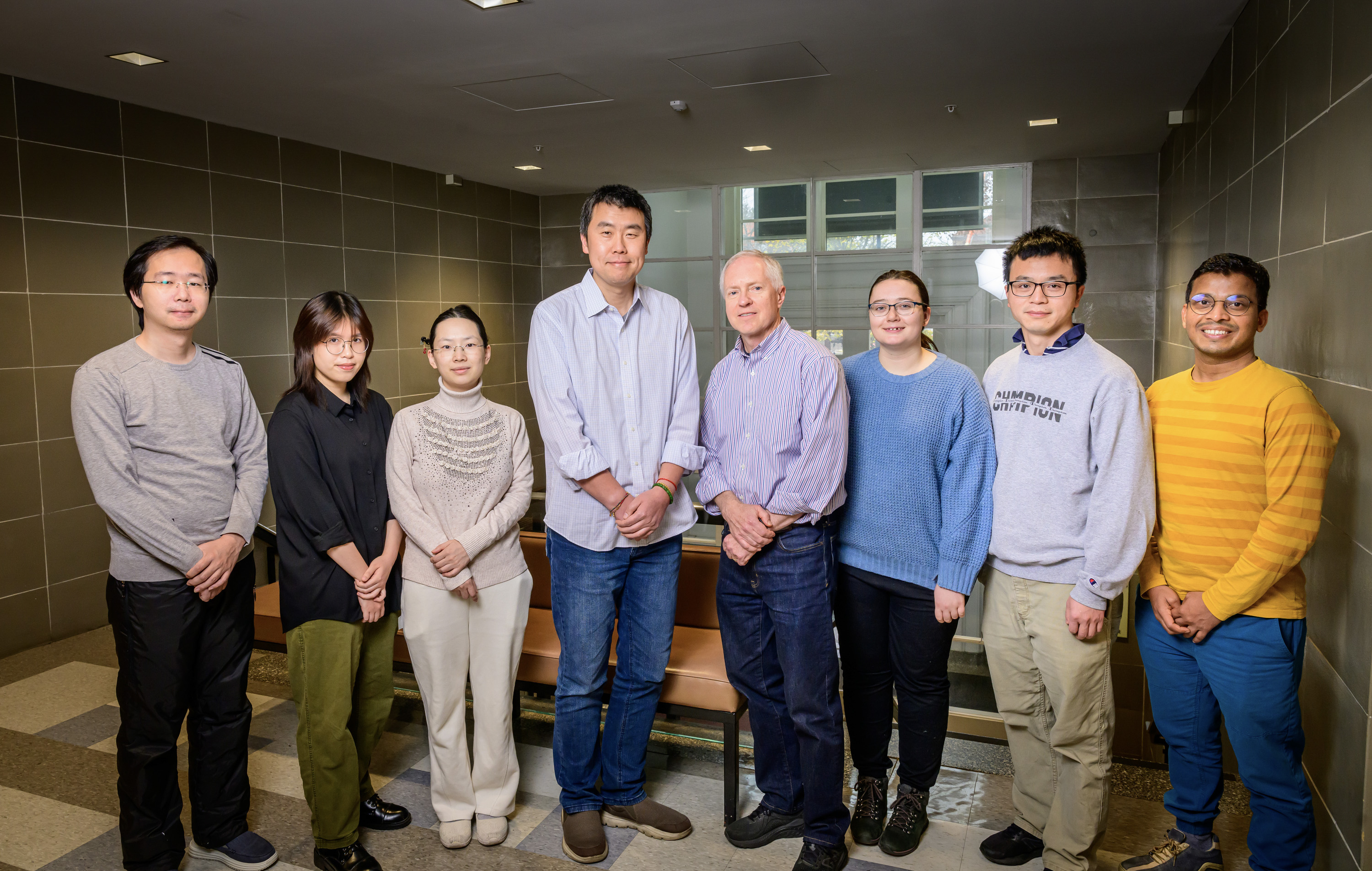 The NanoGripper can be designed to detect a number of viruses or other molecules, or even for targeted drug delivery for cancer treatment, the researchers say. Pictured, from left: researcher Wei Hong, graduate student Linh Le, postdoctoral researcher Mengxi Zheng, Professor Xing Wang, Professor Brian Cunningham, graduate student Skye Shepherd, research fellow Tingjie Song and postdoctoral researcher Saurabh Umrao.